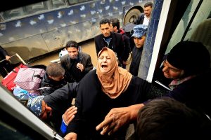 A displaced Iraqi woman, who fled from clashes, reacts as she is transferred to a safe area during a battle between Iraqi forces and Islamic State militants, in Mosul, Iraq March 17, 2017. REUTERS/Thaier Al-Sudani
