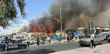 الدفاع المدني يسيطر على في تل باب شمس ويجنب محال المفروشات الكارثة